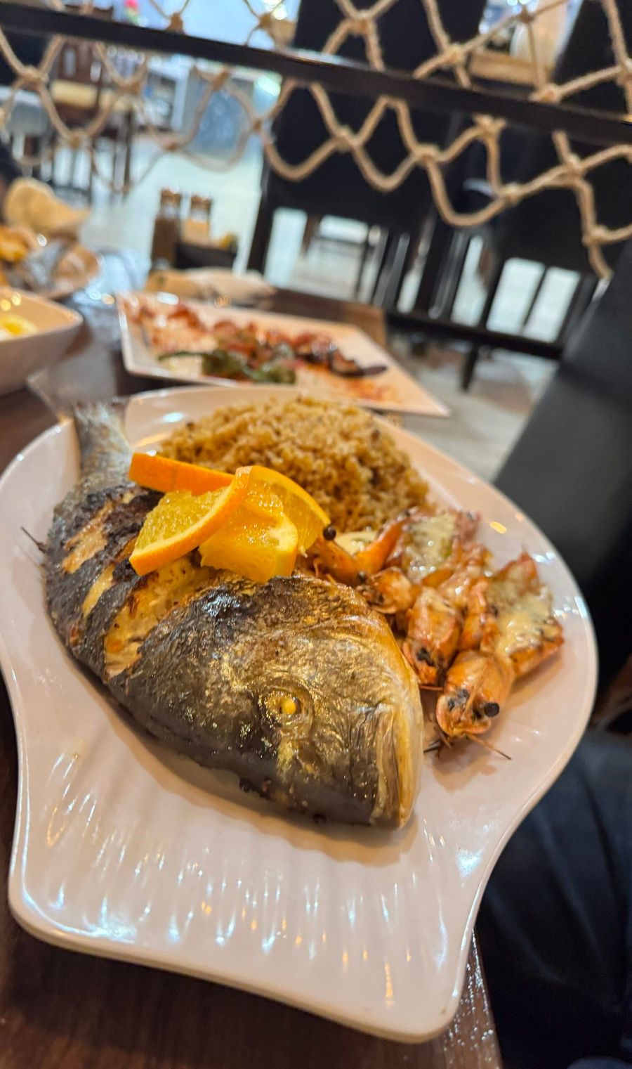 Whole grilled branzino with shrimp and rice